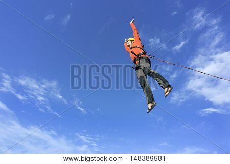 The first jump off the cliff with a safety rope.