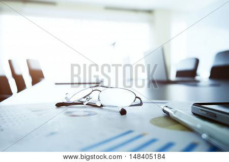 Glasses On Table In Business Meeting Room.