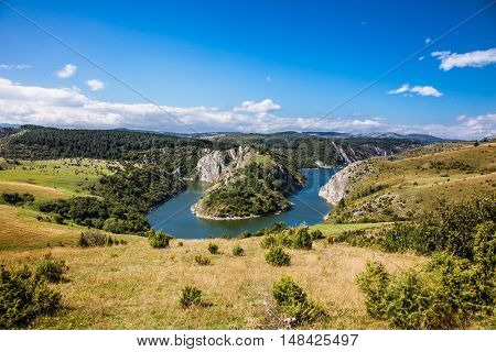 Meanders at rocky river Uvac gorge on sunny day, southwest Serbia.