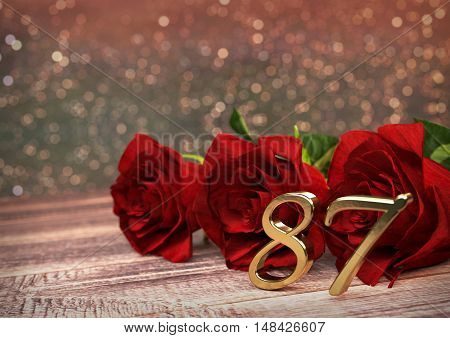 birthday concept with red roses on wooden desk. 3D render - eighty-seventh birthday. 87th