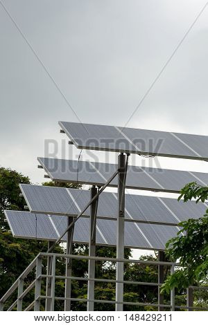 Wide angle photograph of a photovoltaic solar panel array on a rooftop. Energy and conservation concept.
