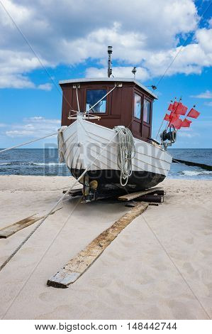 A fishing boat on shore of the Baltic Sea in Koserow (Germany).