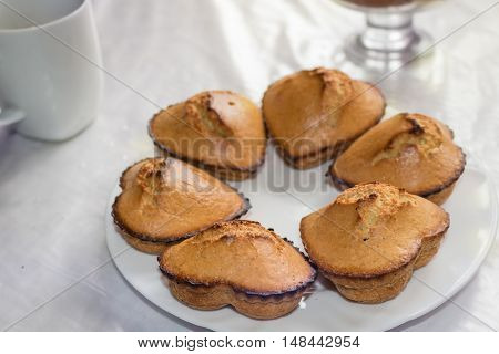 cakes on a table, fresh homemade cupcakes in the shape of heart