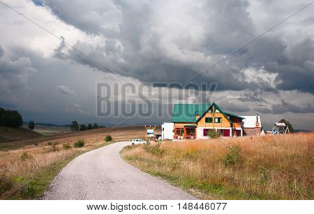 dramatic view at small house on Durmitor National Park plateu.