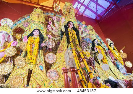 KOLKATA INDIA - OCTOBER 21 2015 : Beautiful interior of decorated Durga Puja pandal at Kolkata West Bengal India. Durga Puja is biggest religious festival of Hinduism.