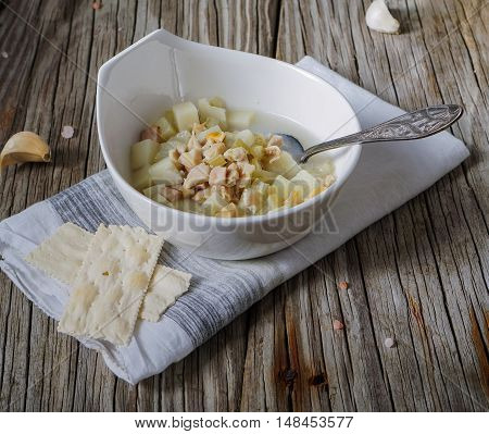 Rhode Island Clam Chowder Soup on Wood Background, selective focus.