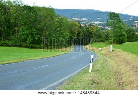 country road winding up through the hills