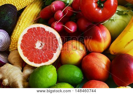 colorful vegetables and fruits with sliced grapefruit