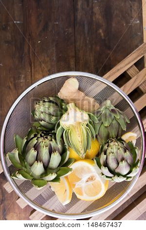 Ripe Organic Artichokes On The Wooden Lattice