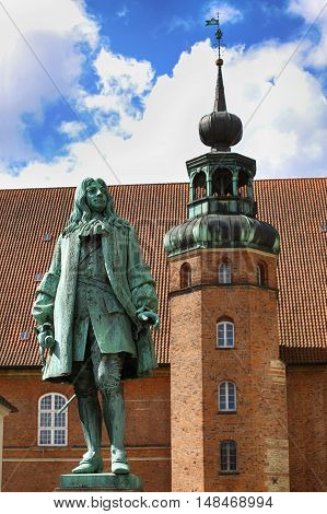 The statue of Chancellor Peder Griffenfeld and a tower in Copenhagen Denmark