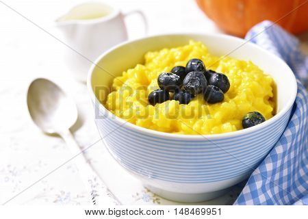 Rice Porridge With Pumpkin And Fresh Blueberry.