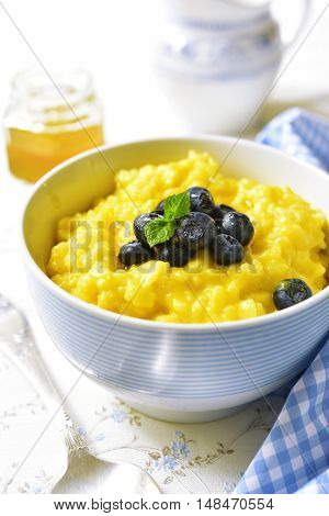 Rice Porridge With Pumpkin And Fresh Blueberry.