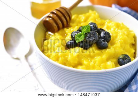 Rice Porridge With Pumpkin And Fresh Blueberry.