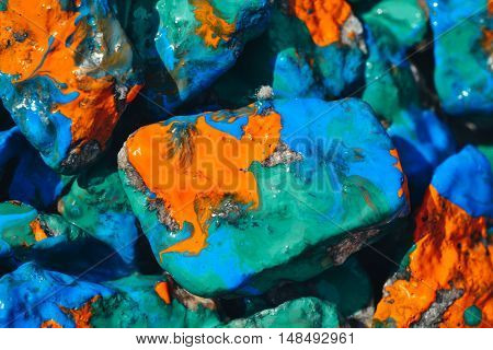 Bright abstract background. Stones painted with paint close
