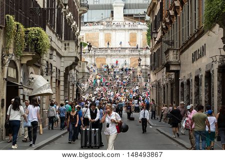 ROME ITALY - JUNE 15 2015: Spanish Steps and Via Condotti in Rome. This street is the center of fashion shopping in Rome with the atelier of Bulgari Armani Cartier Fendi Gucci  and others.