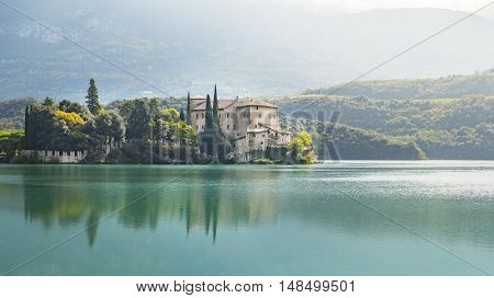 An image of the beautiful Castel Toblino in Italy in the morning light
