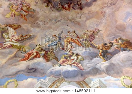 VIENNA AUSTRIA - NOVEMBER 232013: The Karlskirche (St. Charles's Church). Vibrant frescoes of saints and angels decorate the vaulted interior dome of Viennas Karlskirche.