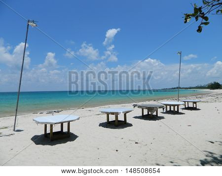 one side of the Tanjung Kelayang beach at Belitung island. used to be used for having outdoor lunch or dinner or beach party. the unique is the artistic way to set the tables.