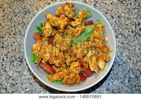 Delicious homemade spicy and healthy chicken salad for recovery food after workout.