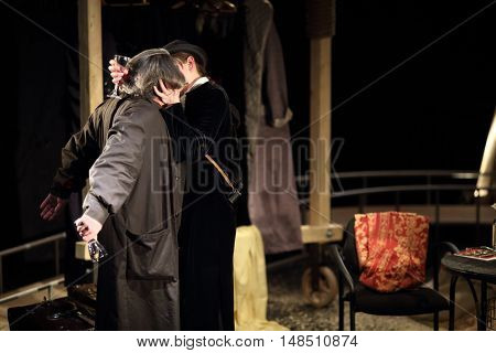 RUSSIA, MOSCOW - APR 15, 2015: Two actors are kissing and playing his characters for performance (Kosmos) at drama theatre Modern.
