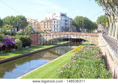 Tet River And A Bridge In Perpignan Between Some Buildings, France