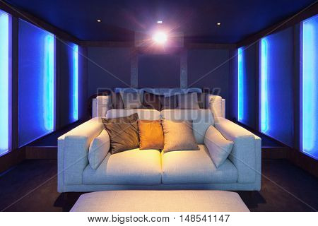 Home theater, luxury interior, comfortable divan and big screen