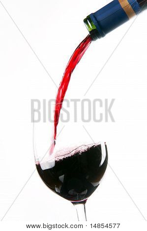 Red Wine Splashes into Stemmed Serving Glass