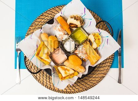 Tasting dish with venezuelan typical food .
