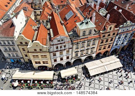 Aerial view of the old town square of Prague Czech Republic with historical buildings and unidentified people. The old town of Prague is protected by UNESCO.