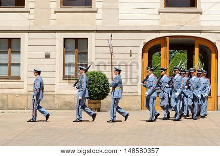 PRAGUE CZECH REPUBLIC - JULY 4 2014: Castle guards (Hradni straz) of presidential palace during ceremonial changing of guards. It takes place daily at noon accompanied by a brass band.