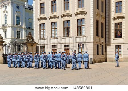PRAGUE, CZECH REPUBLIC - JULY 4, 2014: Castle guards (Hradni straz) of presidential palace during ceremonial changing of guards. It takes place daily at noon accompanied by a brass band.