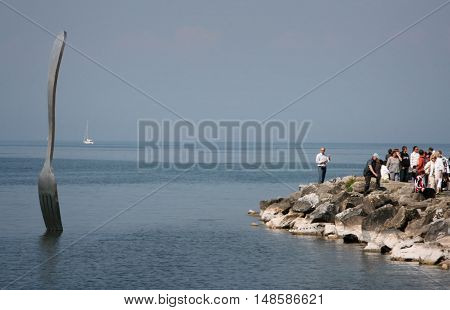 Vevey Switzerland - May 03 2009: Giant Steel Fork In Water Of Geneva Lake Vevey Switzerland.the Fork