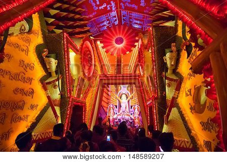 KOLKATA INDIA - OCTOBER 18 2015 : Night image of decorated Durga Puja pandal shot at colored light at Kolkata West Bengal India. Durga Puja is biggest religious festival of Hinduism.