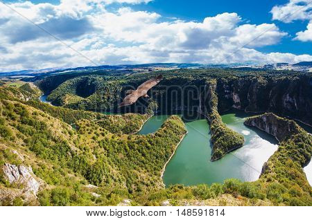 Meanders at rocky river Uvac gorge on sunny day, southwest Serbia.