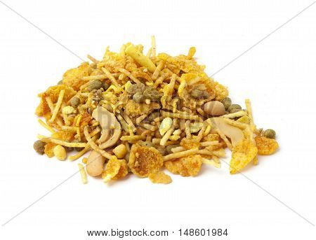 Pile of dry roasted Indian snack mix, isolated over white