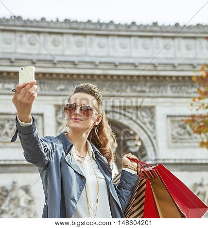 Young Woman Shopper In Paris, France Taking Selfie With Phone