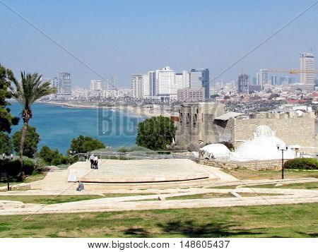 Jaffa Israel - March 22 2012: The Amphitheatre on the background of Skyscrapers of Tel Aviv in old city.