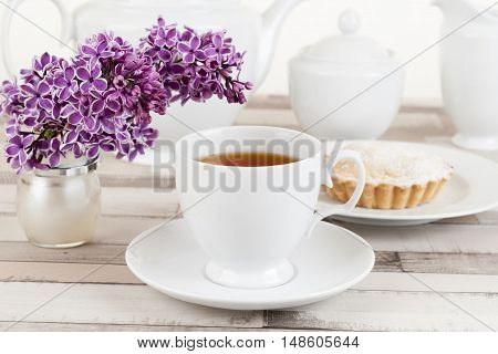 Composition of white porcelain cup of tea