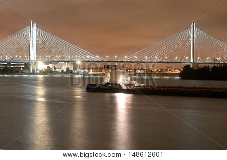 Cable-stayed bridge with illumination across the Neva River in St.Petersburg Russia.