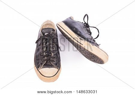 old black canvas shoes on white background