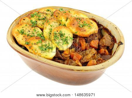 Traditional potato topped Lancashire hotpot isolated on a white background