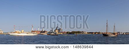 Copenhagen, Denmark - September 14, 2016: Panoramic harbor view with the royal yacht Dannebrog and a sailboat