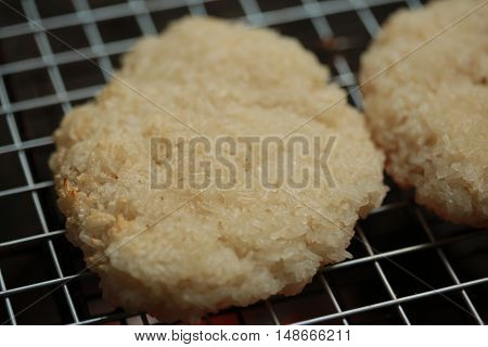 sticky rice with egg grilled Asian traditional food (Kgawhie) at street food in Thailand.