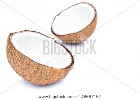 Closeup half of brown coconut shell on white background