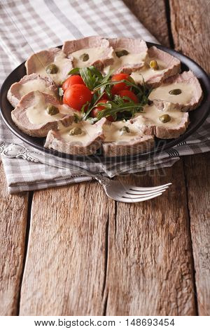 Italian Cuisine: Vitello Tonnato With Capers, Arugula, Tomatoes Close-up. Vertical