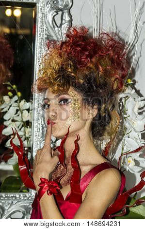 CAGLIARI, ITALY - November 22, 2015: Discovery Extro (fashion makeup and wigs) at the Fiera di Cagliari - portrait of a beautiful girl participant in the demonstration