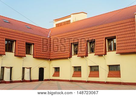 New two-storeyed building with red tiled roof in Trinity Suburb of Minsk Belarus