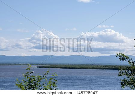 Summer landscape and mountains under the blue sky river
