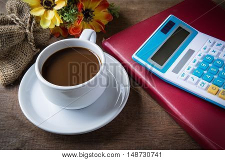 Cup Of Coffee, Books And Calculator, On Table Wood