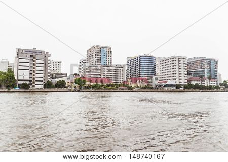 Bangkok Thailand - June 5 2016: Siriraj Hospital view from the other side of Chao Phraya River on cloudy day. It is the oldest and the most famous hospital in Thailand and part of Mahidol university